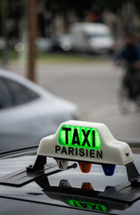 Parisian taxi sign showing availability for passengers in Paris