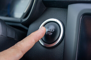In One Touch: Finger Pressing the Vehicle&rsquo;s Start/Stop Button.