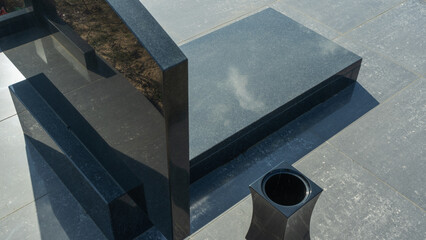 Gravestones at a quiet cemetery honor the memory of loved ones, symbolizing faith, resurrection,...