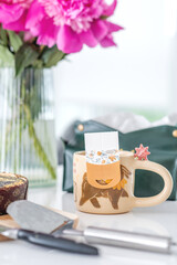 Breakfast: buckwheat tea, poppy seed cake and peonies on the table