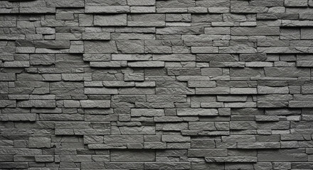 Rough dark gray brick or stone wall texture, rustic and industrial.
