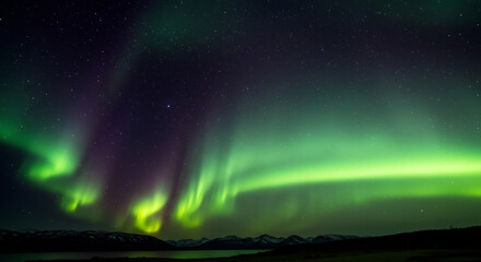 Mesmerizing Aurora Borealis Display Over Icelandic Landscape