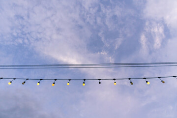 Decorative String Lights Against Sky