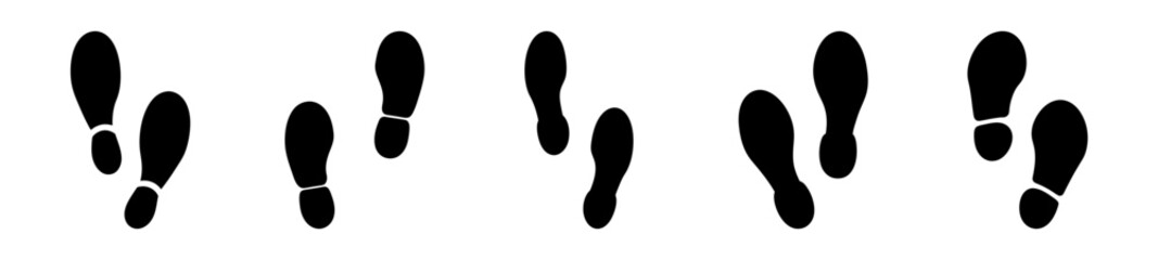 Black Footprint Silhouettes Representing Human Walking on a White Background