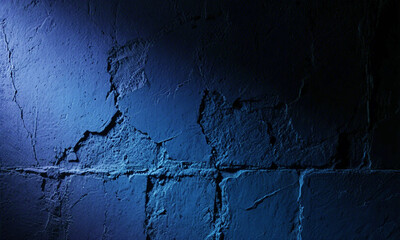 Obraz premium Textured blue wall with cracks and shadows under atmospheric studio lighting