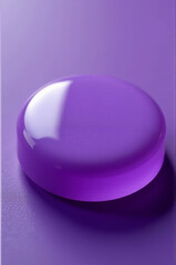 A single purple button sitting on a purple surface, ideal for use as an isolated element in your design or as a visual accent