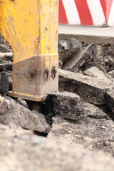 Close-up of a working jackhammer. Hydraulic hammer. Equipment. Hydraulic hammer for road repair....