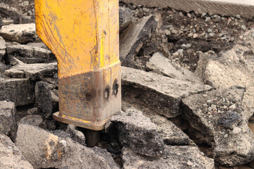 Close-up of a working jackhammer. Hydraulic hammer. Equipment. Hydraulic hammer for road repair....