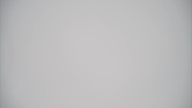A piece of cake on blue plate that is eaten bit by bit. Stop motion animation