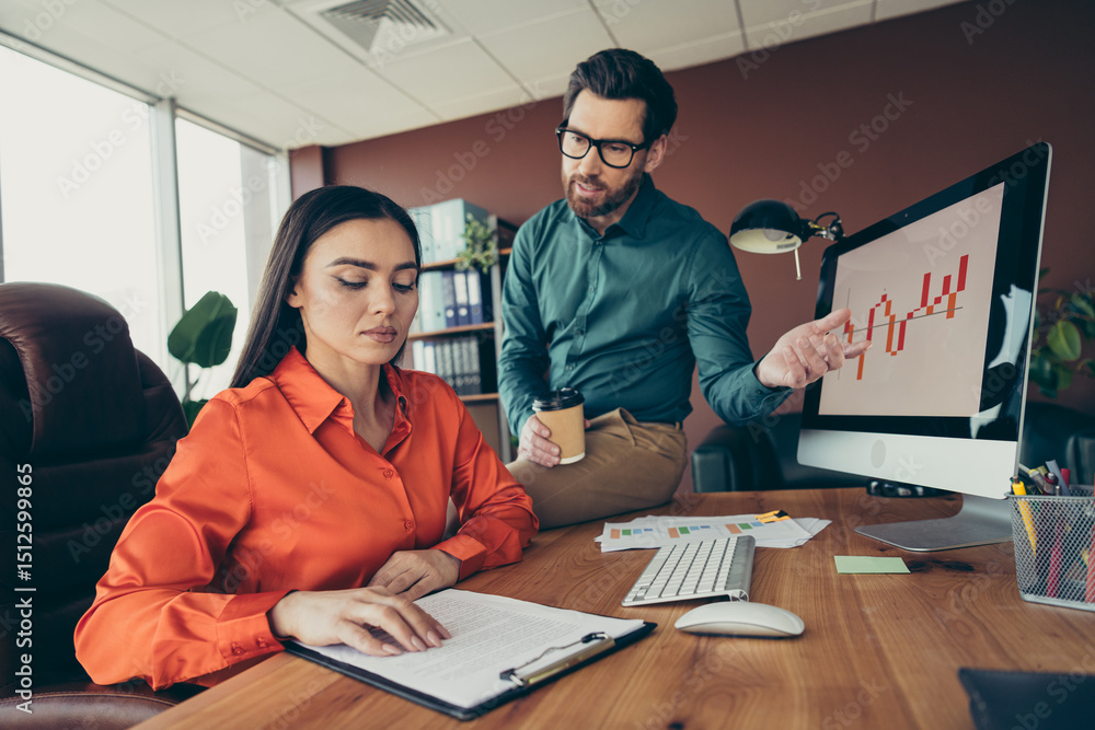 Aufkleber two professionals collaborating on a project in a modern office environment featuring team coordinat