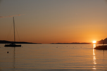 Horizon Sea Sky Background, Sunset sky clouds over sea in the evening with Orange, Yellow sunlight Golden hour in Summer landscape