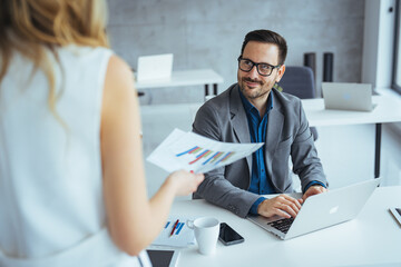 Professional Business Meeting Between Colleagues in a Modern Office Setting