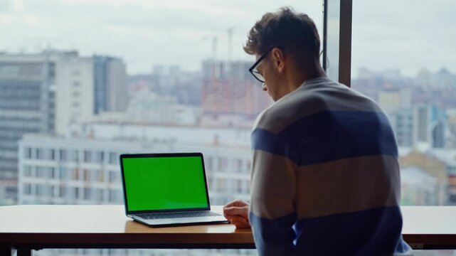 Online student typing mockup laptop computer button in city view library closeup