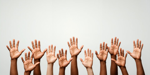 Many diverse hands raised up, palms open, against a light background. Volunteering and unity concept. For questions section in presentation. Horizontal banner with copy space for text.