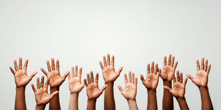 Many diverse hands raised up, palms open, against a light background. Volunteering and unity concept. For questions section in presentation. Horizontal banner with copy space for text.