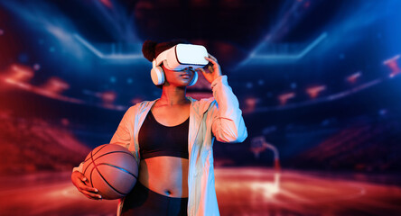 Basketball player holding basketball hologram at futuristic sport arena. Energetic athlete or sport...