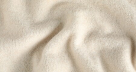 Texture of beige wool fabric as background, top view