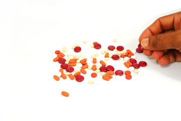 picking a tablet by hand close up view selective focused, medicine pills pickup by hand close-up...