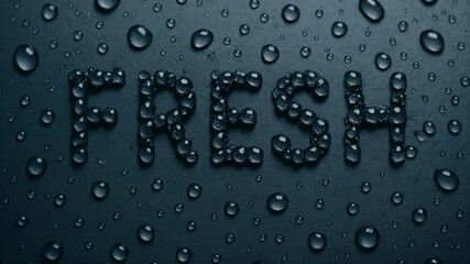 Creative water droplet text spelling “fresh” on dark background