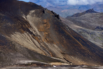 Vast rugged terrain in Iceland showcases the striking volcanic features and unique geology of...