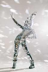 Mirror dancer performing in a sparkling silver costume