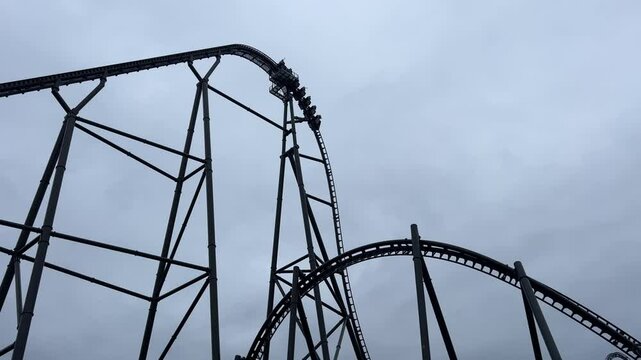 Energylandia, high-speed roller coaster climbs steep track at an amusement park
