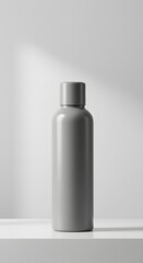 A sleek, matte gray cylindrical bottle
