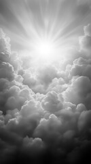 Bright sun rays shining through dramatic gray clouds in heavenly sky.