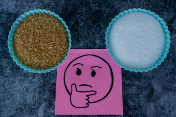 Making a choice of brown and white sugar.