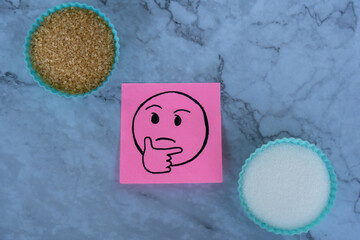 Making a choice of brown and white sugar.