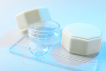 Case with contact lenses on white background, closeup