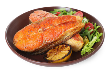 Seafood. Tasty salmon steaks, salad and lemon isolated on white