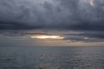 sunset over the adriatic coast of mediterranean sea in piran slovenia at dusk with last light...