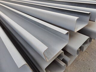 C channel steel or Light-edged channel steel for construction.  C-shaped steel structure.Stacked of Steel Angled Bar