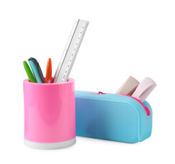 Different stationery in pencil case and pen holder isolated on white