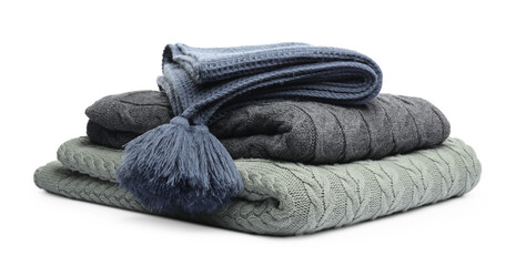 Stack of folded blankets isolated on white