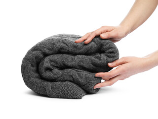 Woman with folded grey blanket on white background, closeup