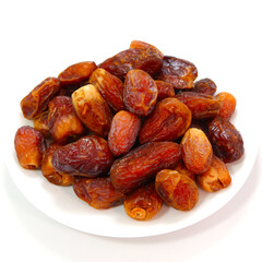 A white plate full of Saudi Arabia Palm Fruits isolated on white background close-up shot, Dates macro photography with plain background 