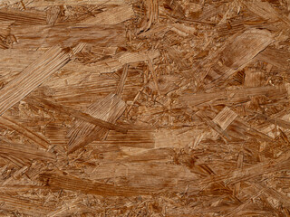 Close-up of OSB (oriented strand board) texture. Ideal for construction, carpentry, architectural design, and material background uses