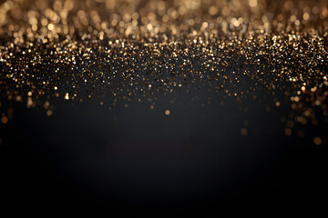 Festive black background with golden glitters on top and copy space.