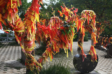 Red ribbons or cloth talismans tied to pillars in Taoist temples at Yuntaishan Geopark is the most beautiful geopark in Henan Province, China.It is listed as the first World Geopark in the world.