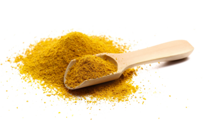  Curry ground pile in wooden spoon isolated on white background, side view