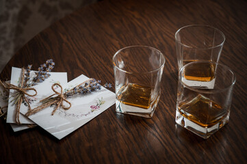 Whiskey Glasses and Lavender Letter on Dark Wood Table, Relaxing Drink, Elegant Still Life, Brown...