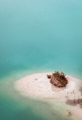 Turquoise water with light milky sand on the shore