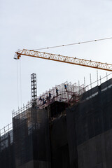 Construction sites with cranes and worker are working in the New building business.