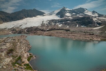 feather women lake under gunsight mountain 