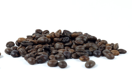 close up of coffee beans on white background