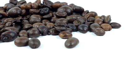 close up of coffee beans on white background