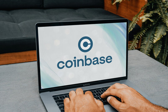 Trader using coinbase cryptocurrency exchange platform on laptop