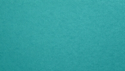 Fototapeta premium Close-up view of a solid, textured teal surface
